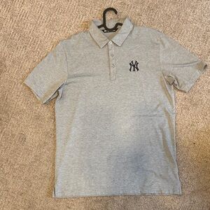 Travis Mathew Light Gray Polo with Black Logo